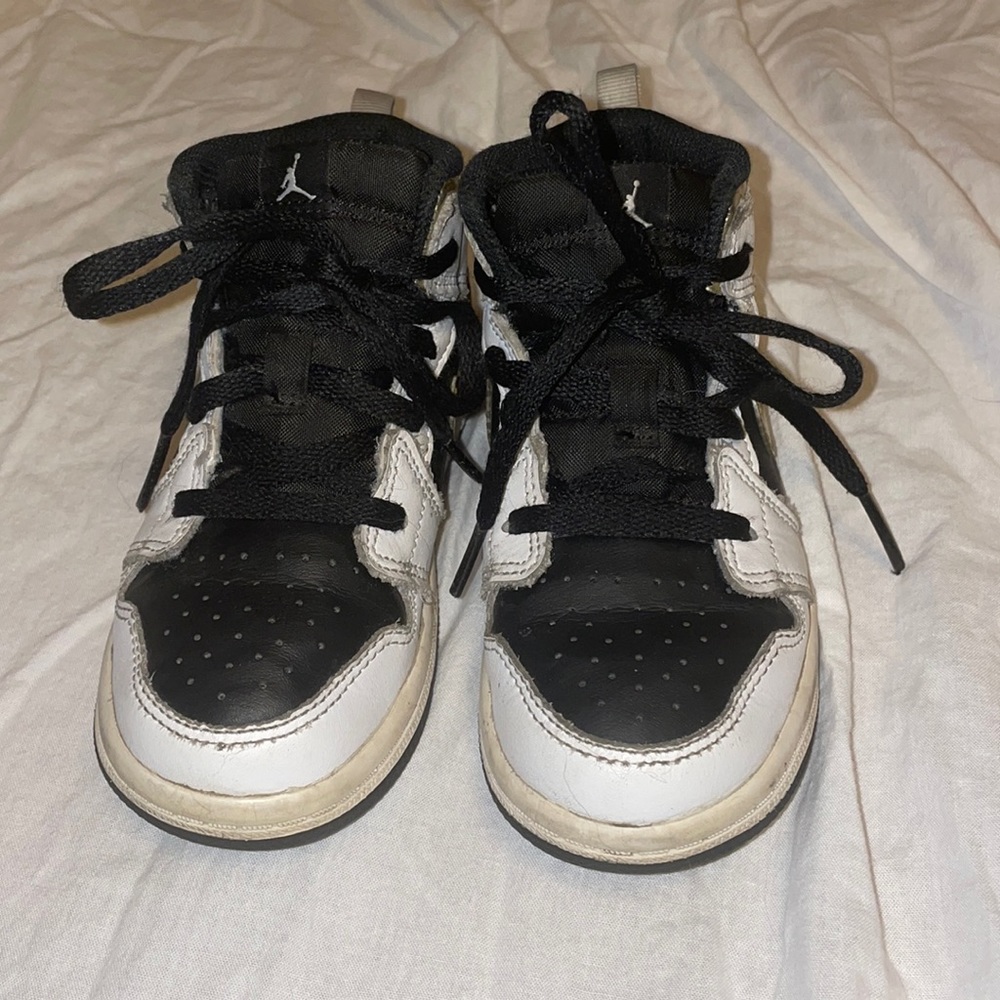 Air Jordan black with gold swoosh